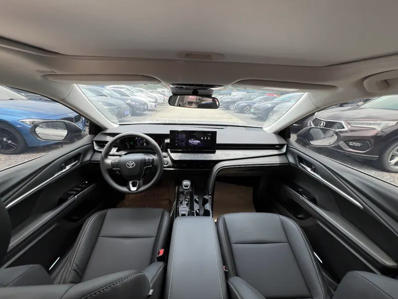 The dashboard and centre console of the same 2024 Toyota Camry Hybrid