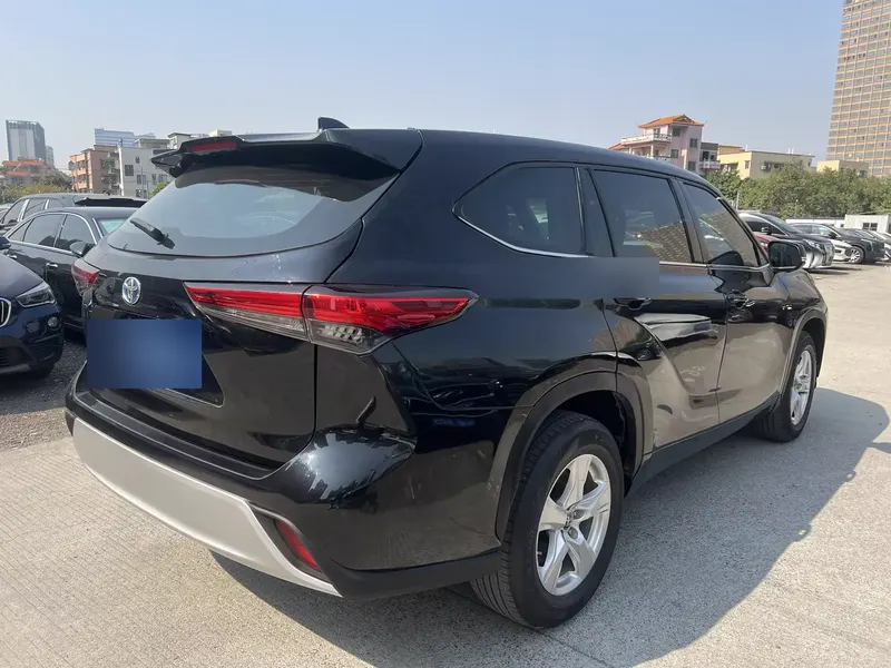 2024 Toyota Highlander Hybrid 2.5L AWD Elite 7-seat — exterior photograph 7 of 9