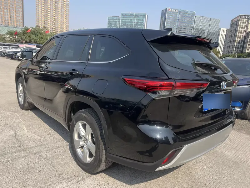 2024 Toyota Highlander Hybrid 2.5L AWD Elite 7-seat — exterior photograph 8 of 9